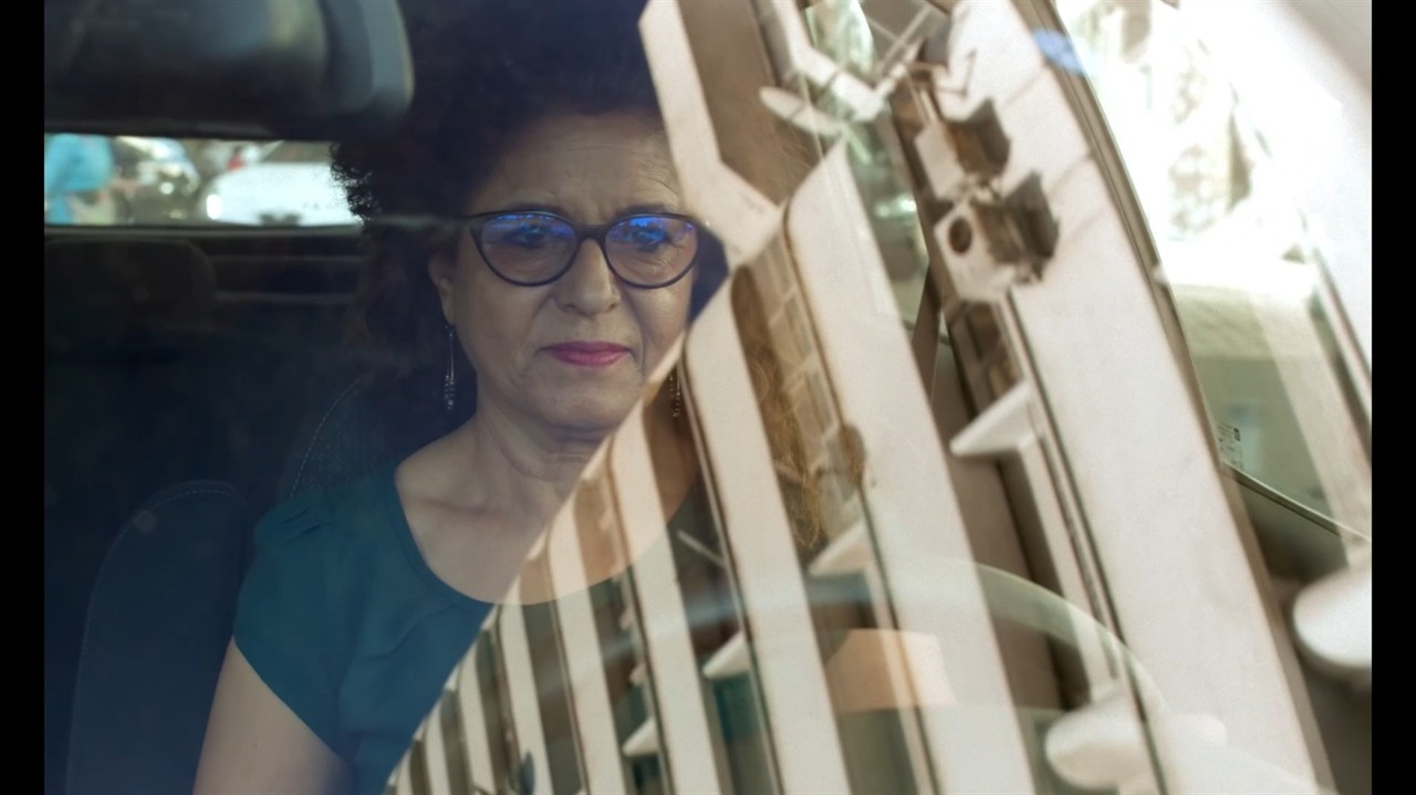 Fatna El Bouih driving, reflection on windsheild